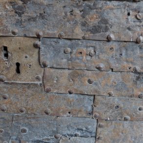 A quilted metal gate with a keyhole