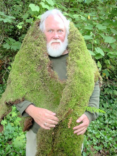 Robert Michael Pyle under a wreath of mos