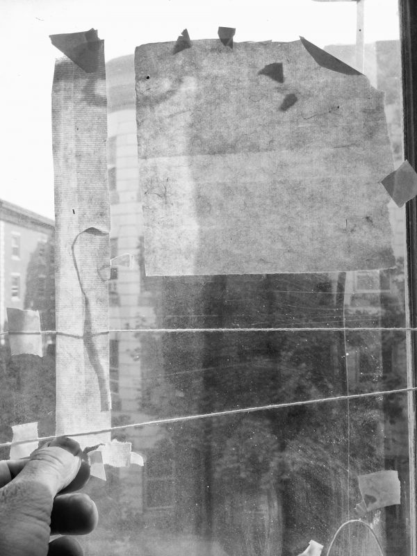 Morning window with paper and string (work in progress).