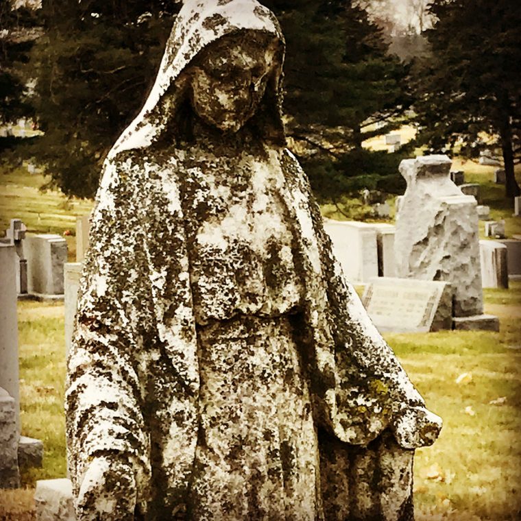 Photo of statue in cemetery by by Kristina Moriconi.