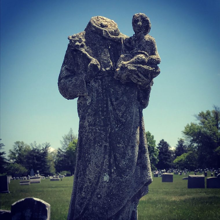 Photo of statue in cemetery by by Kristina Moriconi.
