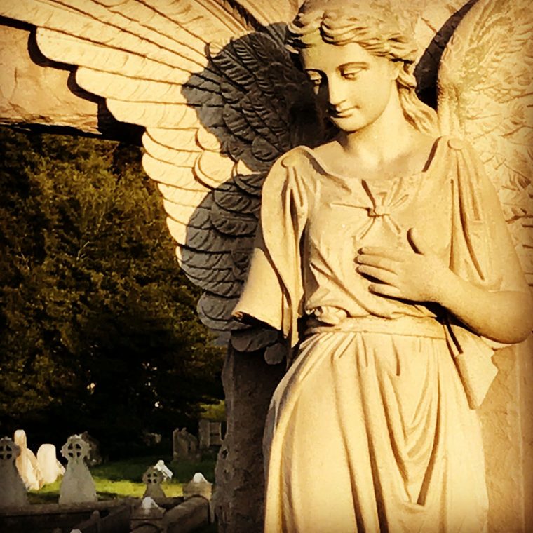 Photo of statue in cemetery by by Kristina Moriconi.