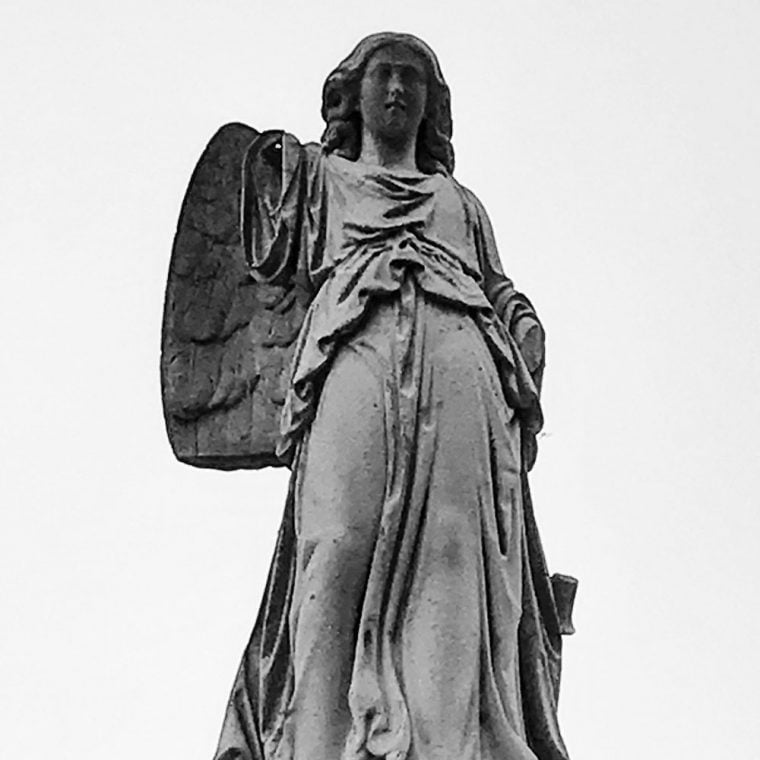 Photo of statue in cemetery by by Kristina Moriconi.
