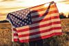 Silhouette of girl holding U.S. flag