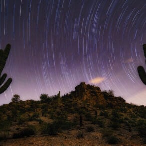 Sonoran desert at night with star tracks