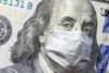 $100 bill with facemask on Ben Franklin