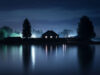 House on lake at night