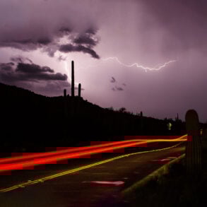 Desert at night, lightning, car taillights