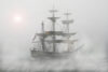 Old sailing ship in fog