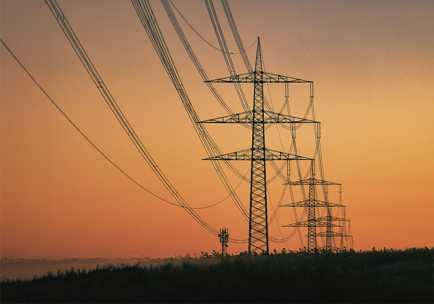 Transmission lines at sunset