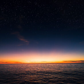 Evening with starry sky over the sea