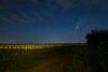 Comet over a field at night