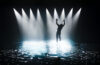 Silhouette of person on stage with water
