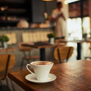 Coffee cup on rustic diner table