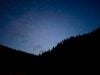 Stars over forested hills silhouette