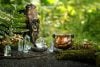 Witch cauldron and crystals outdoors