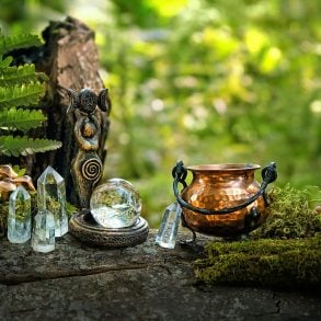 Witch cauldron and crystals outdoors